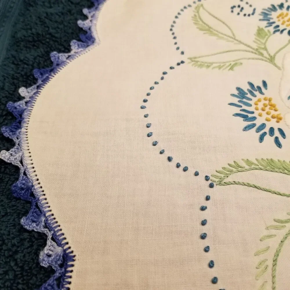 vintage handmade floral needlework table runner with a crocheted border